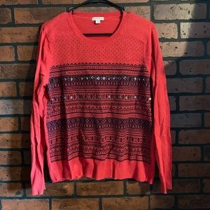 Red sweater with jewels and black design